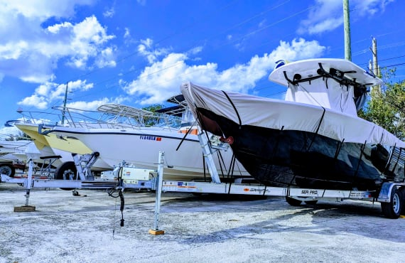 Rows of boats on trailers parked in storage