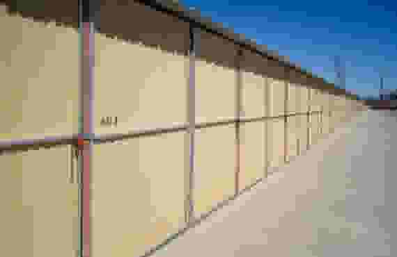 This image shows a row of outdoor storage units end to end