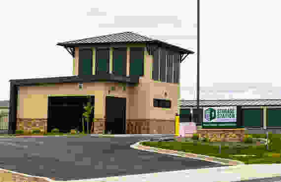 office - facility entrance with storage units and move-in truck in background
