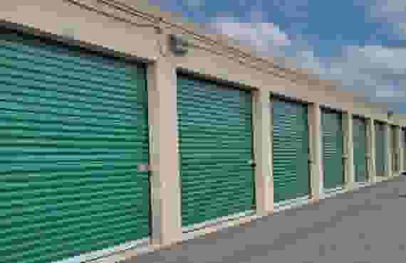 A row of drive-up storage units.