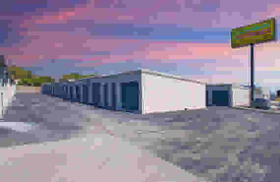 Several exterior drive-up storage unit buildings. A Lockaway Storage sign is visible in the background.