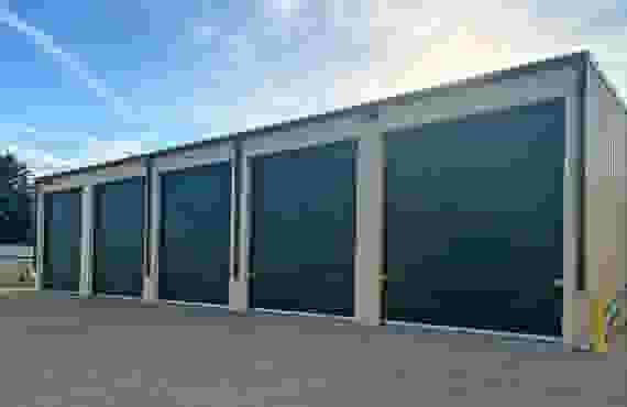 Four exterior drive-up storage units.