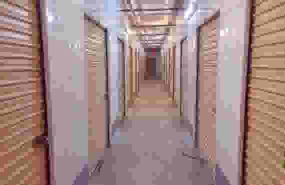 An interior hallway lined with storage units.