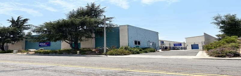 The front of the property. A StaxUP Storage sign is mounted on the front office building.