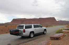 Stowaway cargo carrier on white SUV in Utah