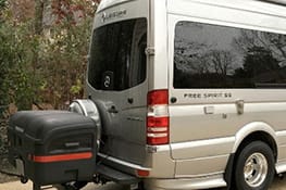 Stowaway box on a gray shuttle bus