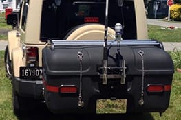 Stowaway cargo carrier on a beige Jeep