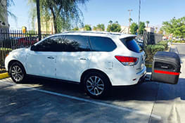 Stowaway cargo carrier on a white Nissan Pathfinder