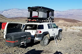 Stowaway cargo carrier on a white Jeep in Death Valley