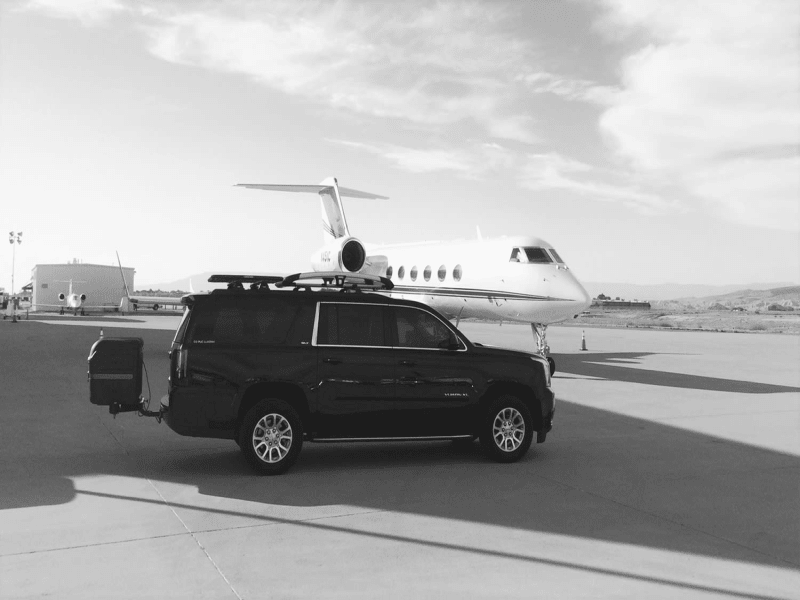 GMC Yukon with Stowaway Standard Cargo Box with Dual Hitch Towing a Boat