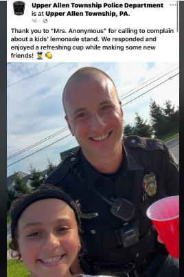 Police enjoy lemonade from a lemonade stand in wholesome moment