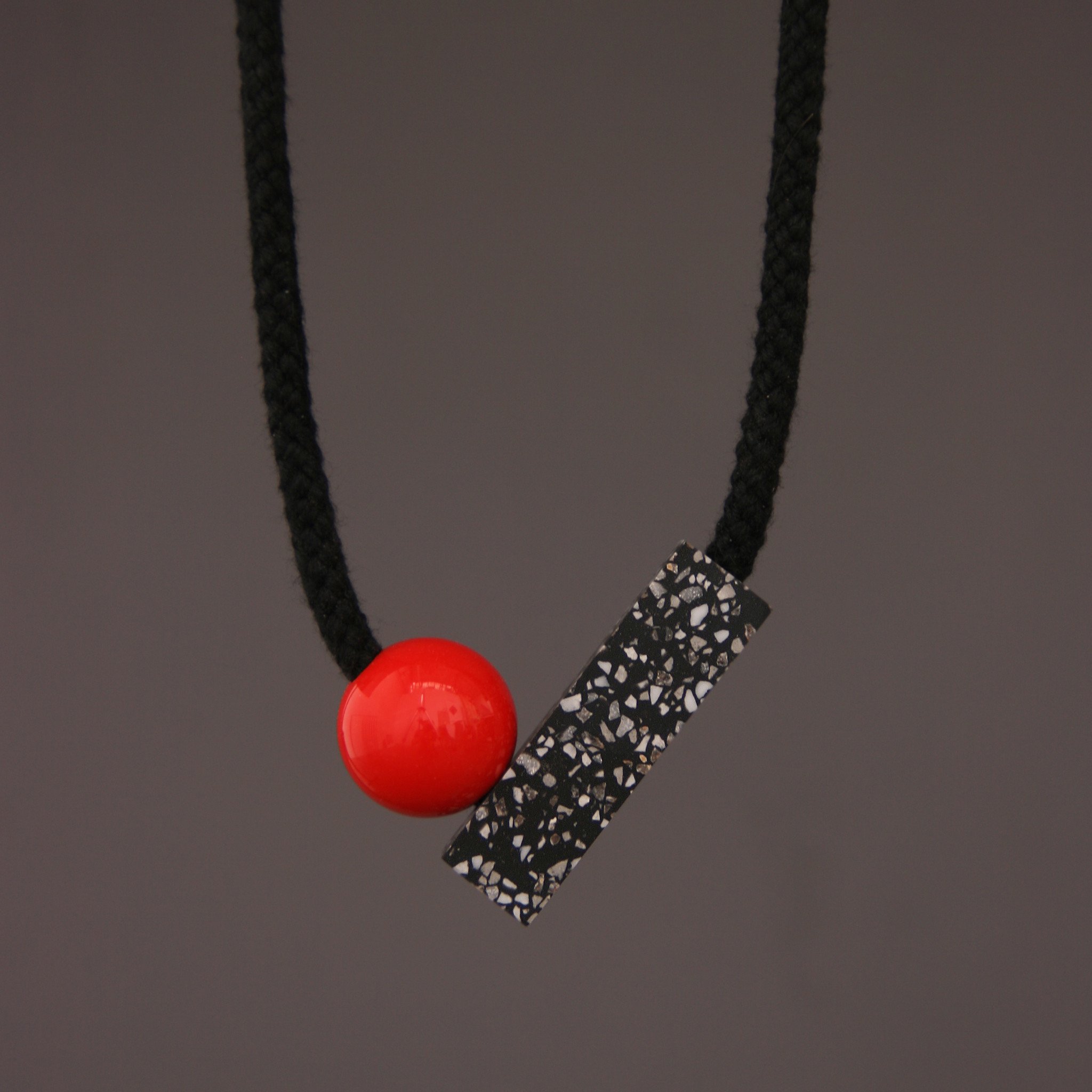 One We Made Earlier Ad Necklace with Red Ball 