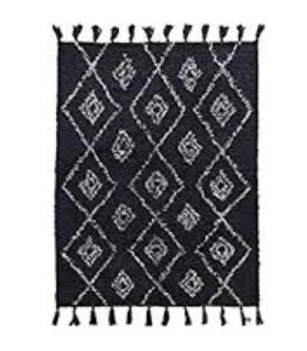 House Doctor Rectangular rug 200x140cm in black with beige pattern and fringes at the ends.