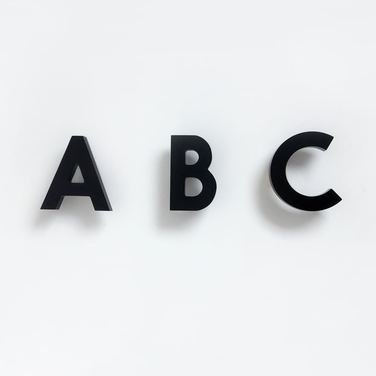 rock-and-pebble-alphabet-soup-wall-hooks-abc-black