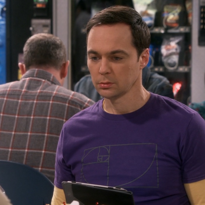 Sheldon Cooper on purple golden spiral shirt