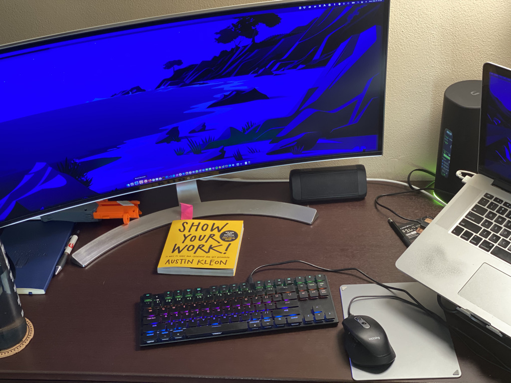 Desk with computer keyboard and monitor