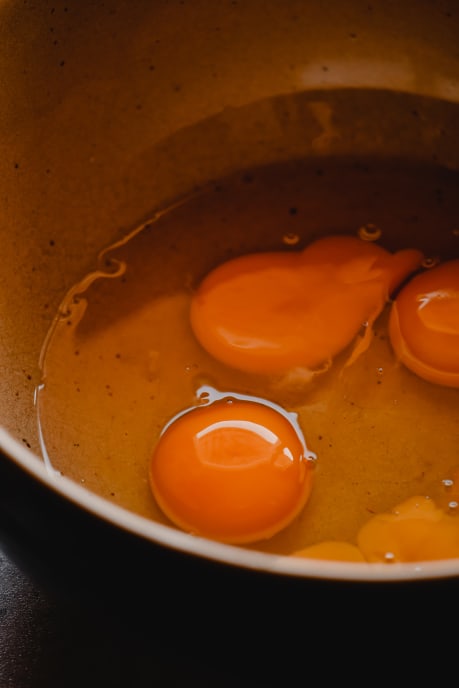 Cracked eggs in a bowl