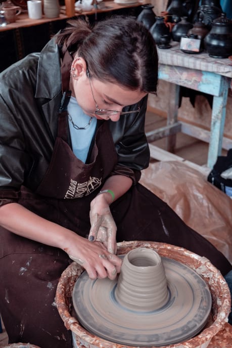 Girl making pottery