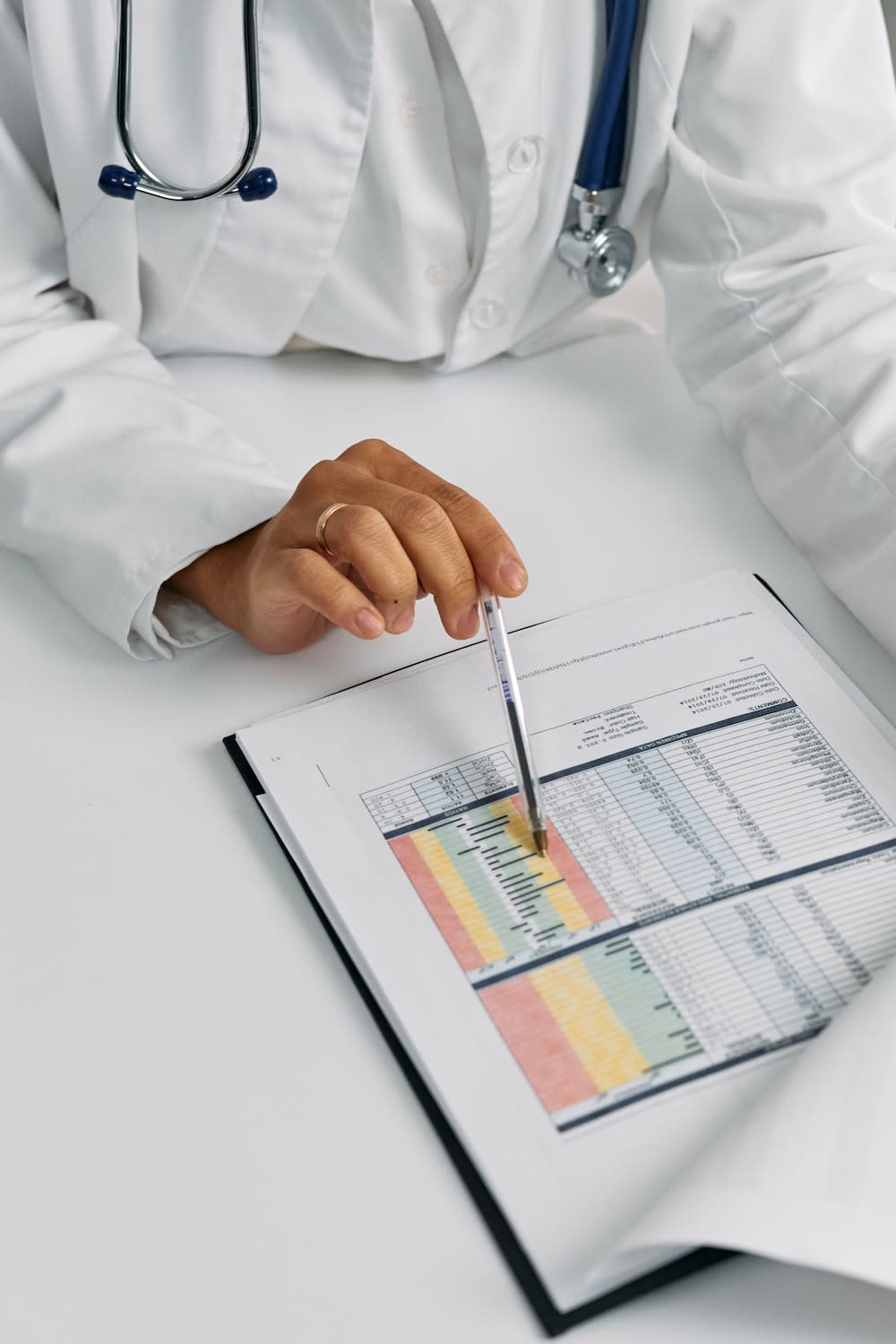A doctor reading a patient's medical report