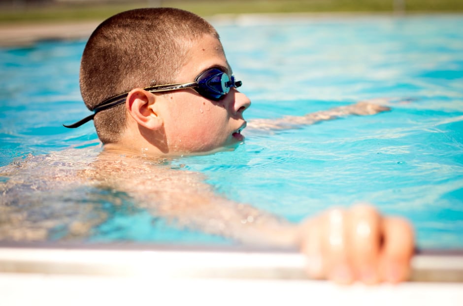 A boy swimming in a pool