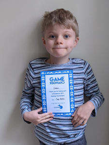 Leon with his Game Changers certificate from the Duchenne UK gaming day