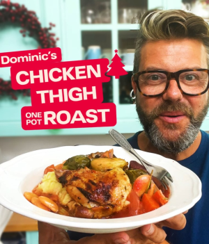 Chef holding plate of Christmas thigh roast