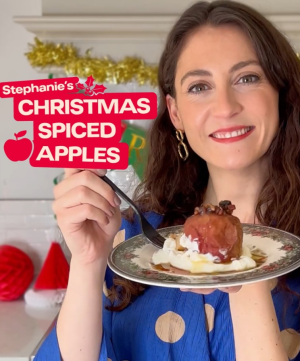 Chef holding plate of Christmas spiced apples