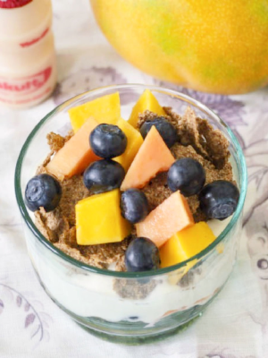 Bowl of cereal with fruit and Yakult Original