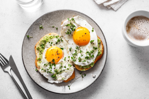 Avocado egg on toast and coffee, breakfast