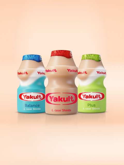 Yakult Original, Yakult Balance and Yakult Plus bottles on a cream background