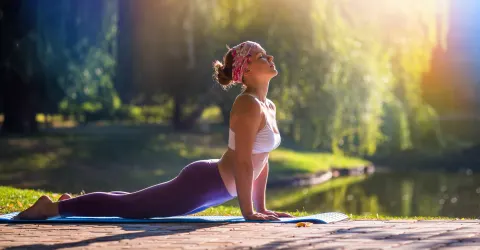 Women doing yoga outside