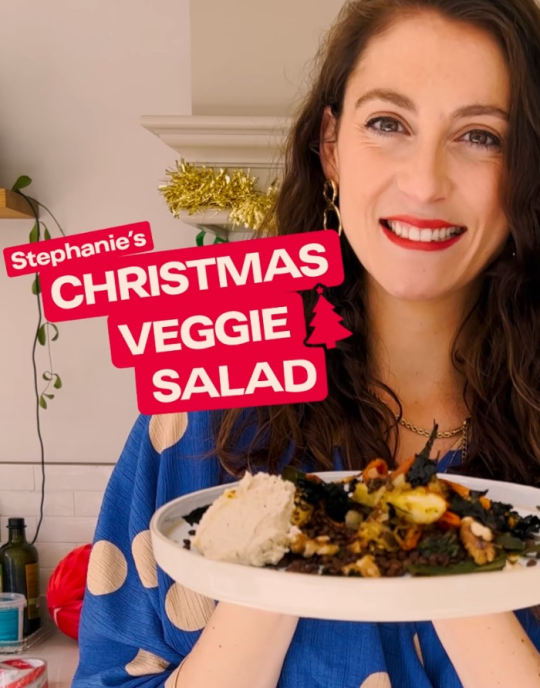 Chef holding plate of Christmas veggie salad