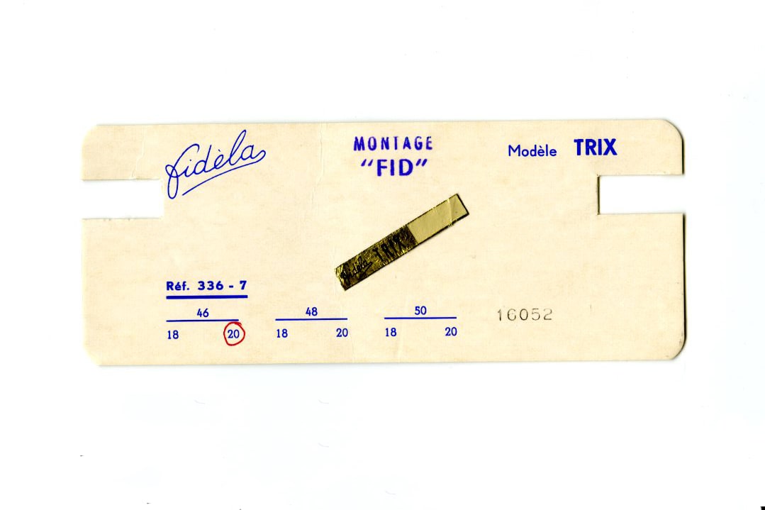 This image shows a old cardboard packaging that was used in factories to mark the glasses size, color and shape