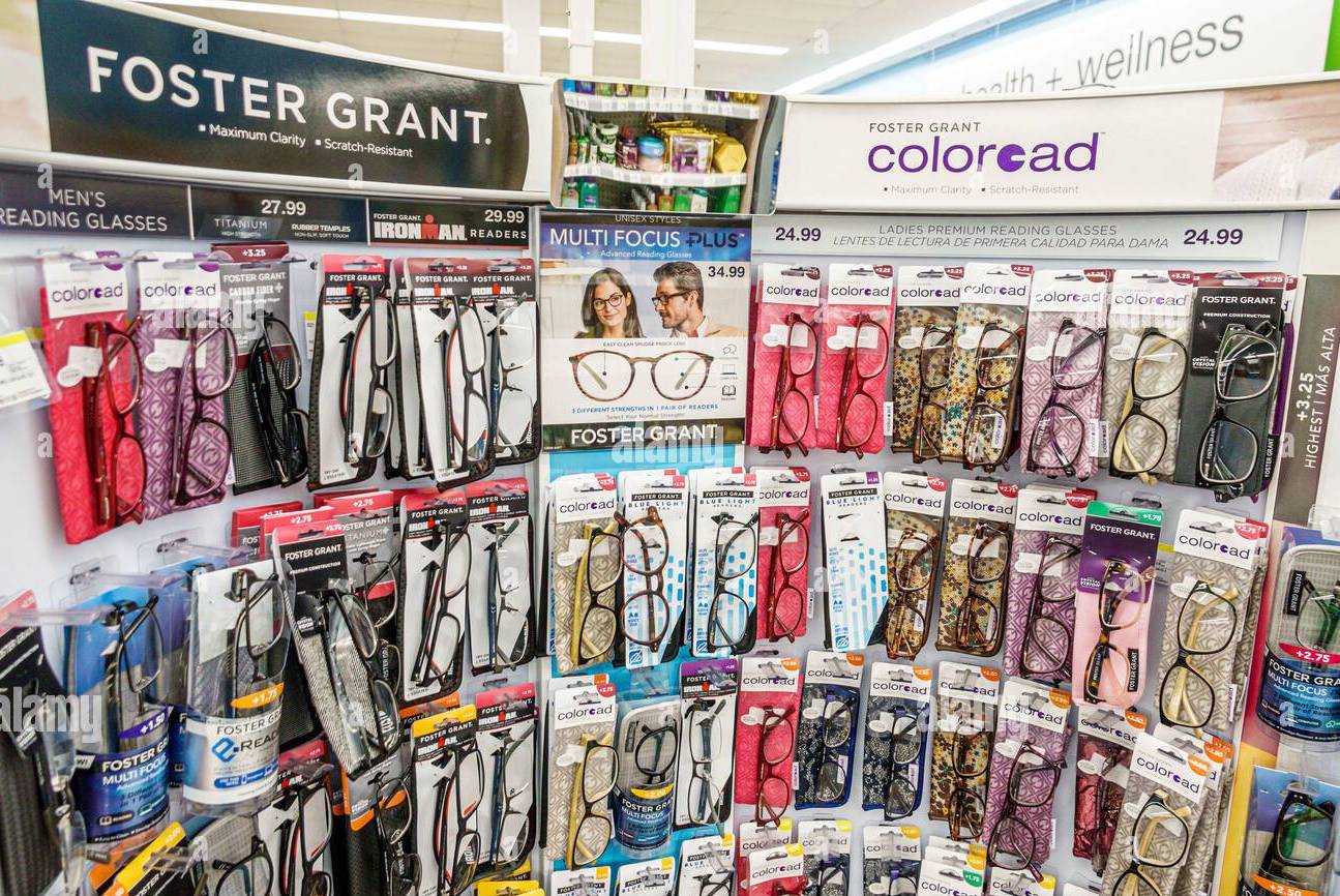 A background picture full of cheap reading glasses in a gas station.
