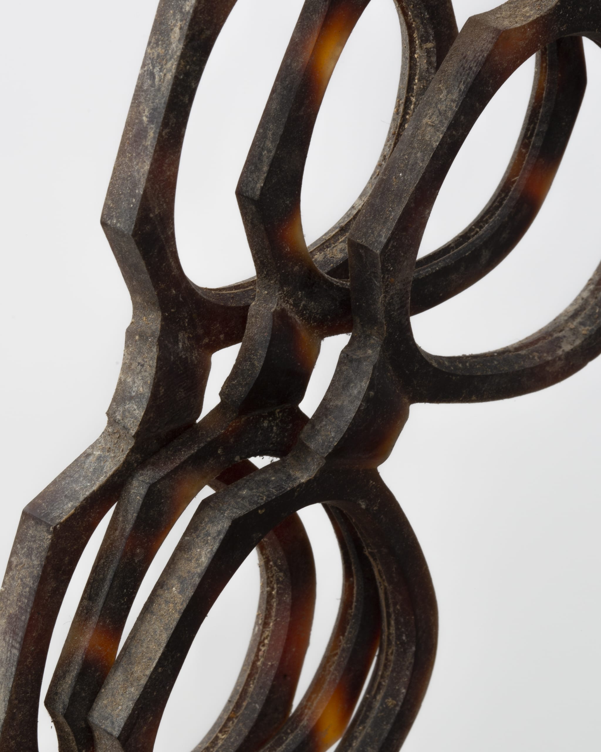 Three plates of reddish-brown amber transluscent celluloid fronts, in their raw condition. A lot of dust/dirt is still on the frames.