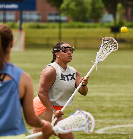 woman catching a ball while playing
