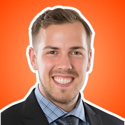 Headshot of Charlie Rhea, smiling against an orange background