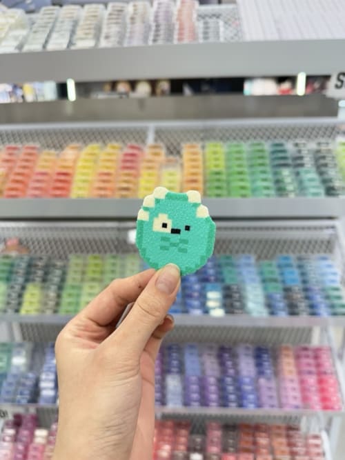 Perler bead green monster, towel with glitter finish