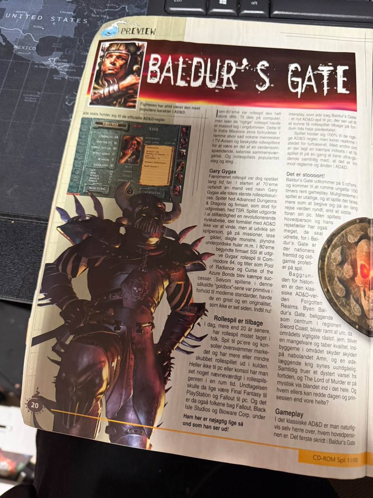 My photograph of page 20 of CD-ROM Spil 11/1998, showing the Baldur’s Gate heading, character record and preview text
