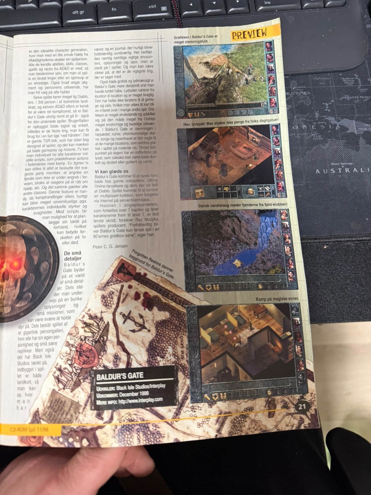 My photograph of page 21 of CD-ROM Spil’s Baldur’s Gate preview, with gameplay screenshots, captions, author credit and release information