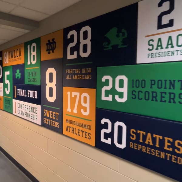 SEG locker room graphics showing colorful fabric panels with team statistics and achievements in silicone edge frames.