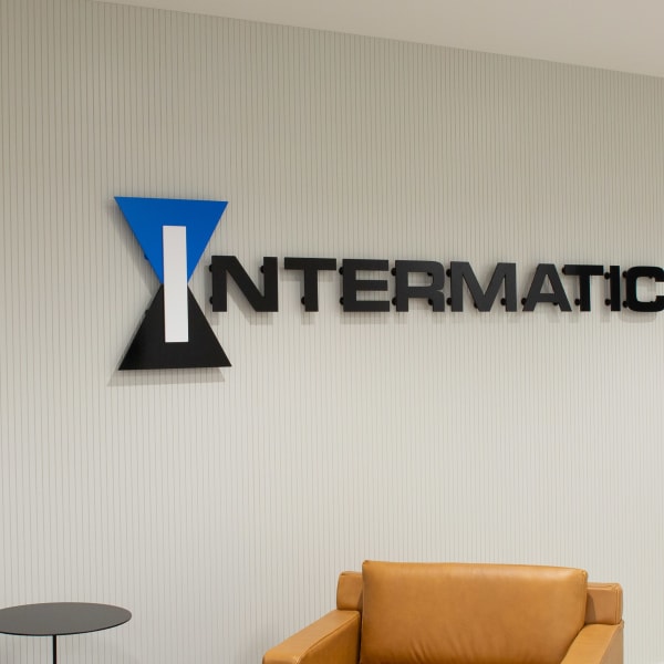 Lobby sign featuring dimensional lettering with the Intermatic logo and brand name mounted on a textured wall.