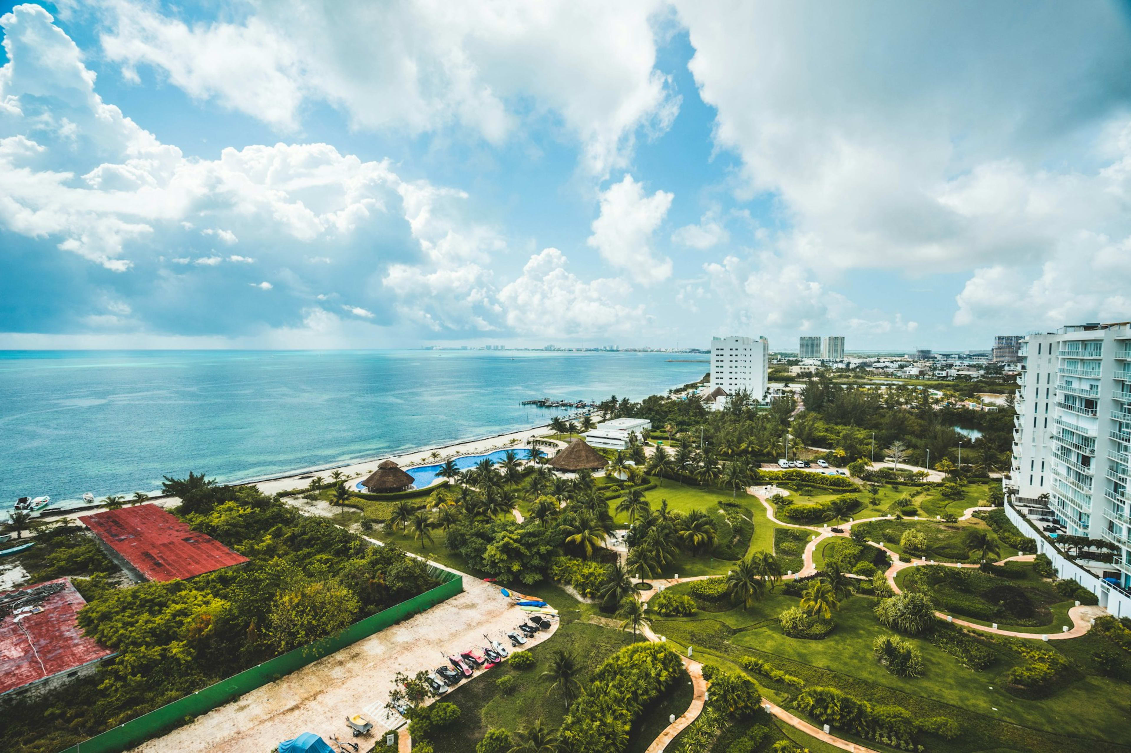 Turquoise Caribbean beachfront vacation rental in Cancun Hotel Zone at golden hour