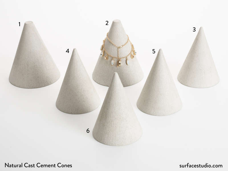 Natural Cast Cement Cones (6)  $40 each (H3)