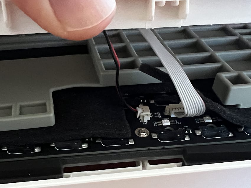 showing two cables inside the keyboard case