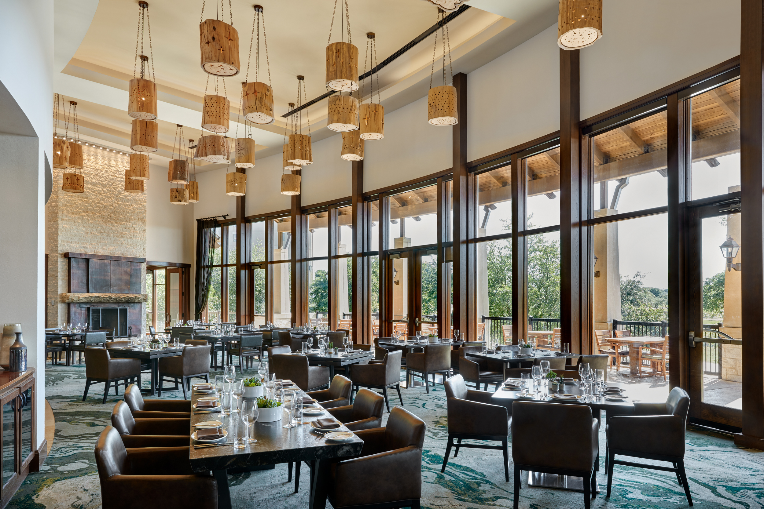 Elegant dining area with floor to ceiling windows.