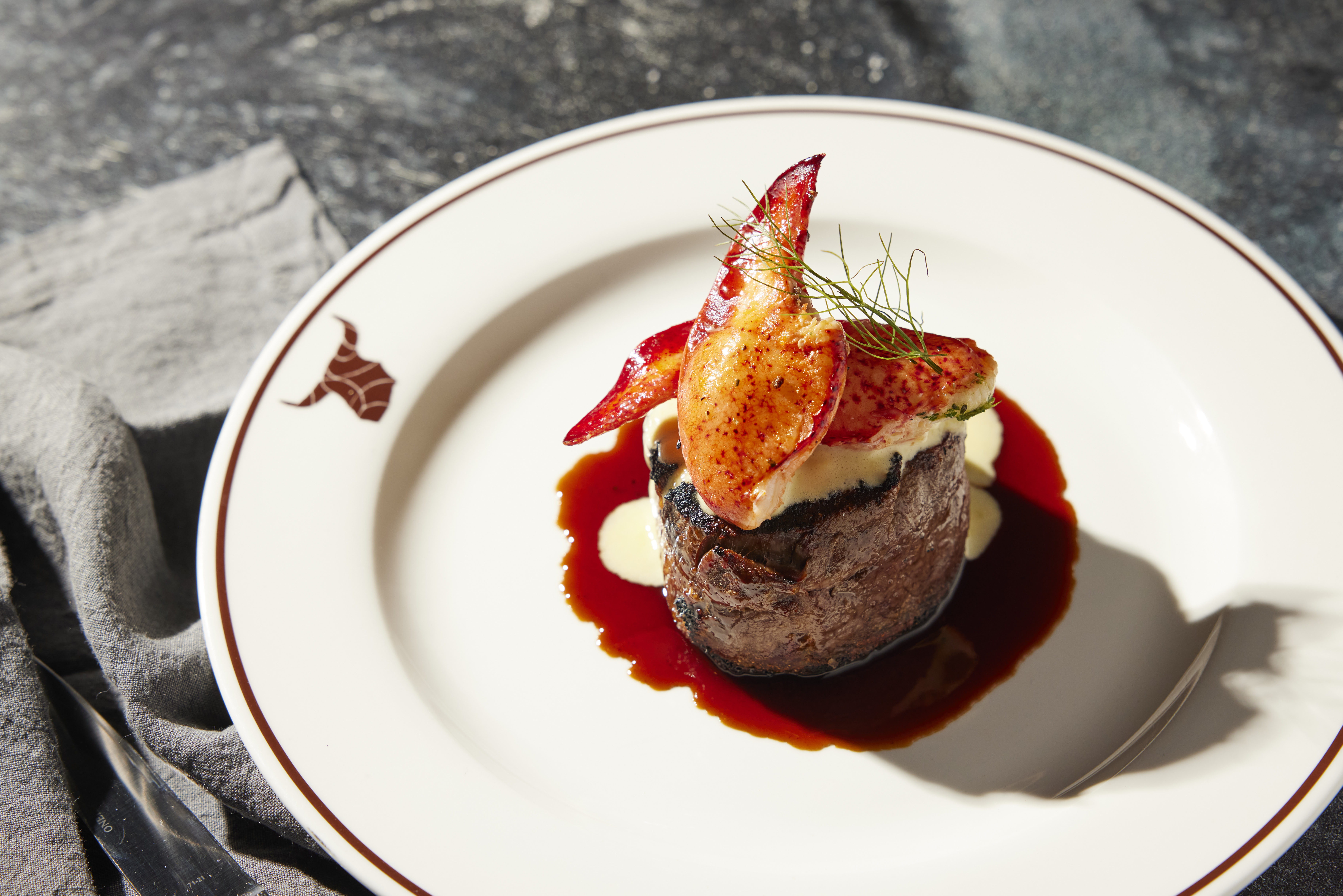 Surf n turf dish with elegant lighting.