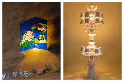 A two-panel artist collage highlighting sculptural light design: the left panel shows an illuminated stained-glass wall sconce featuring blooming water lilies against vibrant blue water by Bengaluru-based glass artist Asad, mounted on a textured wall above mosaic floral accents; the right panel shows the 7-foot tall white clay Legacy Totem floor lamp glowing softly by Mumbai-based ceramic artist Harshita Jhamtani.