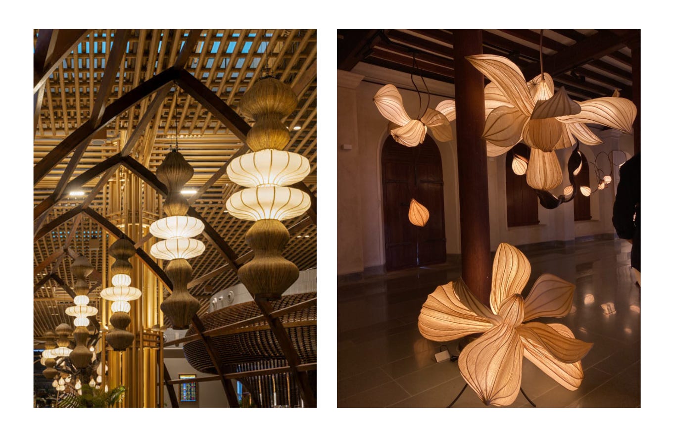 A two-panel image collage showcasing eco-friendly paper light installations by Jenny Pinto: the left panel shows tall, stacked organic banana-fiber paper light towers suspended beneath the vaulted bamboo architecture of Kempegowda International Airport Terminal 2 in Bengaluru; the right panel shows warm, petal-shaped botanical light sculptures resembling glowing lily blossoms suspended and standing inside an interior space.