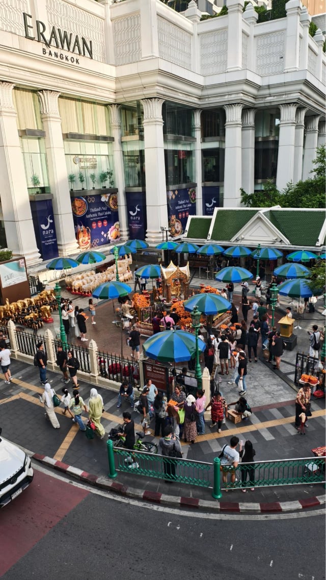 Aerial view of the Erawan Shrine plaza and worshippers in front of the Grand Hyatt Erawan Bangkok